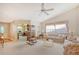 Bright and airy living room features large windows, plush carpeting, and comfortable seating at 5395 Christie Ann Pl # 9, Sarasota, FL 34233