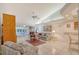 Open living room featuring tile floors, vaulted ceilings, and lanai access at 5395 Christie Ann Pl # 9, Sarasota, FL 34233