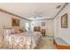Main bedroom features a ceiling fan, artwork, and ensuite bathroom access at 5395 Christie Ann Pl # 9, Sarasota, FL 34233