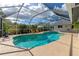 Inviting swimming pool with spa and screened enclosure at 5721 31St E Ct, Bradenton, FL 34203