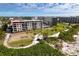 Aerial view highlighting condo building's beach proximity at 5740 Midnight Pass Rd # 506F, Sarasota, FL 34242