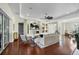 Living room with hardwood floors, fireplace, and built-in shelving at 575 Fore Dr, Bradenton, FL 34208