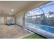 Covered patio with retractable screens and pool view at 575 Fore Dr, Bradenton, FL 34208