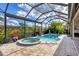 Enclosed pool and spa with retractable shade at 575 Fore Dr, Bradenton, FL 34208