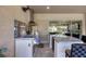 Stainless steel outdoor kitchen with grill and bar seating at 575 Fore Dr, Bradenton, FL 34208