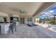 Spacious lanai with pool, spa, and outdoor kitchen at 575 Fore Dr, Bradenton, FL 34208