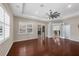 Bright living room with hardwood floors, high ceilings, and access to other rooms at 575 Fore Dr, Bradenton, FL 34208