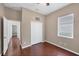 Bright bedroom with wood floors, double doors, and window blinds at 575 Fore Dr, Bradenton, FL 34208