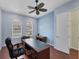 Home office with wood floors, desk, and arched windows at 575 Fore Dr, Bradenton, FL 34208