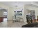 Bright breakfast nook with a built-in bench and view of the pool area at 575 Fore Dr, Bradenton, FL 34208
