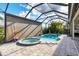 Enclosed pool and spa with retractable shade at 575 Fore Dr, Bradenton, FL 34208
