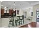 Modern kitchen with granite countertops, stainless steel appliances, and breakfast bar at 575 Fore Dr, Bradenton, FL 34208