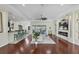 Bright and airy living room with hardwood floors, a fireplace, and plenty of natural light at 575 Fore Dr, Bradenton, FL 34208