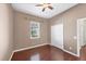 Bright bedroom with hardwood floors and ceiling fan at 575 Fore Dr, Bradenton, FL 34208