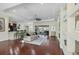 Open concept living room with hardwood floors and access to kitchen and dining area at 575 Fore Dr, Bradenton, FL 34208