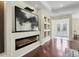 Elegant entryway with hardwood floors and a modern fireplace at 575 Fore Dr, Bradenton, FL 34208