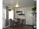 Bright dining area with a glass table and four gray chairs at 5804 15Th W St, Bradenton, FL 34207