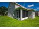 Side view of house with screened porch and green grass at 6227 Blue Runner Ct, Lakewood Ranch, FL 34202