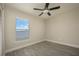 Bright bedroom with wood-look floors and ceiling fan at 6227 Blue Runner Ct, Lakewood Ranch, FL 34202