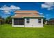 Rear view of house showing screened porch and yard at 6227 Blue Runner Ct, Lakewood Ranch, FL 34202