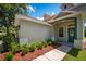 Exterior view of the home, showcasing landscaping and a front entrance at 6227 Blue Runner Ct, Lakewood Ranch, FL 34202