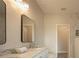 Bathroom with double vanity, granite countertops and large mirrors at 6227 Blue Runner Ct, Lakewood Ranch, FL 34202