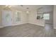 Bright dining room features wood-look floors, and an open concept design at 6227 Blue Runner Ct, Lakewood Ranch, FL 34202