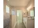 Spa-like bathroom with walk-in shower, double vanity and marble tile at 6227 Blue Runner Ct, Lakewood Ranch, FL 34202