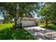 Two-car garage with a paved driveway and landscaping at 6227 Blue Runner Ct, Lakewood Ranch, FL 34202