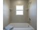 Bathroom with a shower/tub combo and neutral tile at 6227 Blue Runner Ct, Lakewood Ranch, FL 34202
