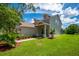 Two-story home with landscaping, attached garage, and inviting front entrance at 6227 Blue Runner Ct, Lakewood Ranch, FL 34202
