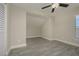 Bedroom with wood-look floors, ceiling fan and built-in nook at 6227 Blue Runner Ct, Lakewood Ranch, FL 34202