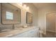 Bathroom with double vanity, granite countertops and large mirrors at 6227 Blue Runner Ct, Lakewood Ranch, FL 34202