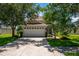 Two-story home with attached garage and landscaped yard at 6227 Blue Runner Ct, Lakewood Ranch, FL 34202
