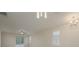 Open living space with a neutral color palette, ceiling fan, and large windows at 6227 Blue Runner Ct, Lakewood Ranch, FL 34202
