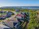 Aerial view of house and neighborhood with water access at 6248 Champions Row, Bradenton, FL 34210