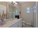 Bright bathroom with a vanity, toilet and shower at 6248 Champions Row, Bradenton, FL 34210