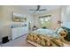 Spacious bedroom with a large TV, dresser, and plush bedding at 6248 Champions Row, Bradenton, FL 34210