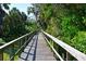 Scenic boardwalk through lush landscaping at 6248 Champions Row, Bradenton, FL 34210