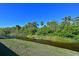 Peaceful view of a canal with lush greenery at 6248 Champions Row, Bradenton, FL 34210