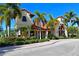 Attractive community clubhouse with palm trees at 6248 Champions Row, Bradenton, FL 34210