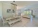 Farmhouse-style dining area with a large table and bench seating at 6248 Champions Row, Bradenton, FL 34210