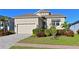 Attractive single-story home with a two-car garage and well-manicured landscaping at 6248 Champions Row, Bradenton, FL 34210