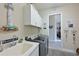 Laundry room with washer, dryer, and utility sink at 6248 Champions Row, Bradenton, FL 34210