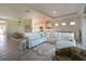 Open concept living room with sectional sofa and view into the kitchen at 6248 Champions Row, Bradenton, FL 34210