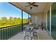 Relaxing screened porch with table and chairs at 6248 Champions Row, Bradenton, FL 34210