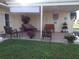 Relaxing patio space with comfortable seating and lush green lawn at 670 Park Cir, Bradenton, FL 34207