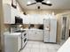 Modern kitchen featuring white cabinets, stainless steel appliances, and an eat-in area at 7225 Cedar Hollow Cir # 20-201, Bradenton, FL 34203