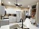 Modern kitchen with white cabinets, new countertops and a large island at 7225 Cedar Hollow Cir # 20-201, Bradenton, FL 34203