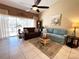 Relaxing living room with seating area and large windows offering natural light at 7225 Cedar Hollow Cir # 20-201, Bradenton, FL 34203